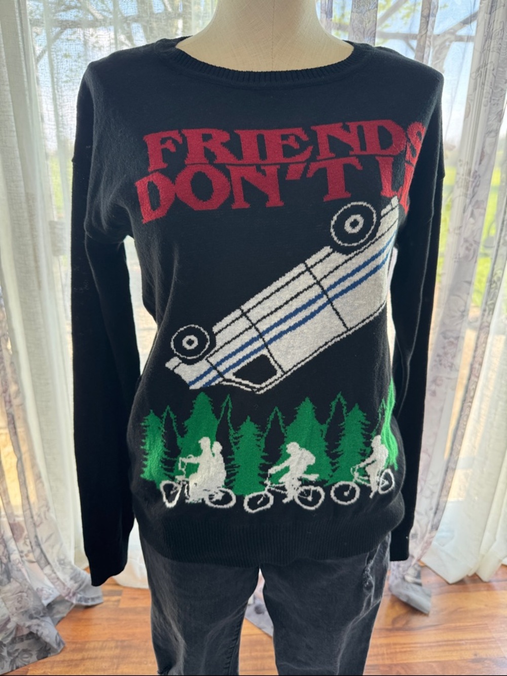 Stranger Things Black Graphic Crewneck Sweater with Red Slogan and Forest Bike